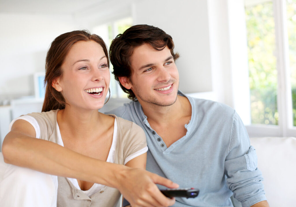 couple with new TV antenna installed